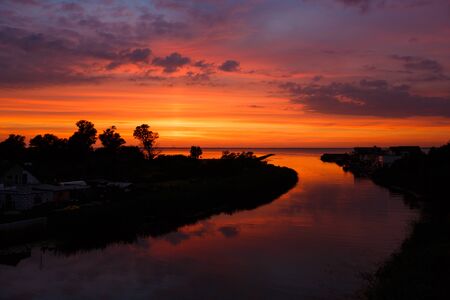 Beautiful sunset with incredible reflection at the summer timeの写真素材