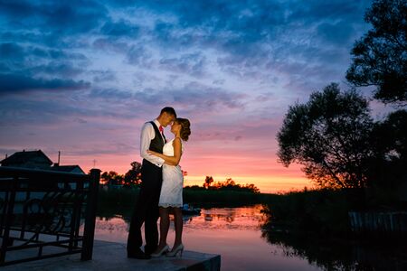 Wedding couple in love at sunset summer timeの写真素材