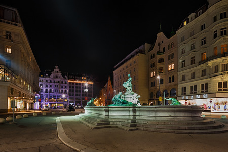 Vienna, Austria, January 06 2014: View of the sculpture in the fountain with illumination at night timeのeditorial素材