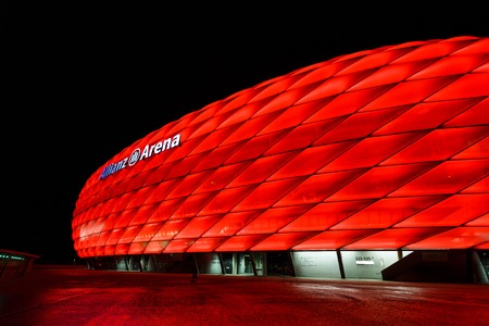 Munich, Germany - January 05 2016: View of the red color Allianz Arena at night time, is a great football stadium in the city with a 75,024 seating capacityのeditorial素材