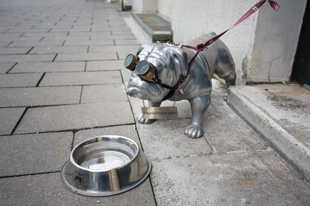 Munich, Germany - January 08 2016: Metal monument bulldog with bowl, located in Odeon square of Munichのeditorial素材