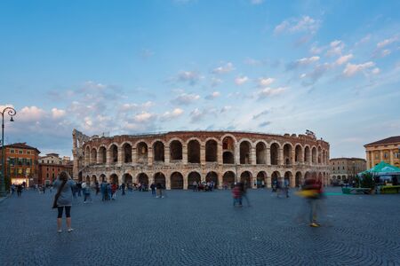 Verona, Italy - May 07 2016: Some people walking on the Bra square against the backdrop of the Verona Arena, evening timeのeditorial素材