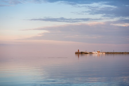 The pier at the evening calm seaの写真素材