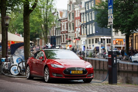 Amsterdam, Netherlands - July 01 2016: Tesla car being charged on a street of Amsterdamのeditorial素材