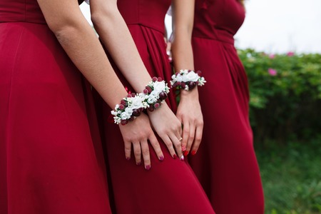 Wedding bracelets on hands of bridesmaids outdoorの写真素材