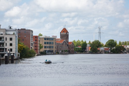 Zaandam, Netherlands - July 02 2016: Industrial area on the embankment of the river, summer timeのeditorial素材