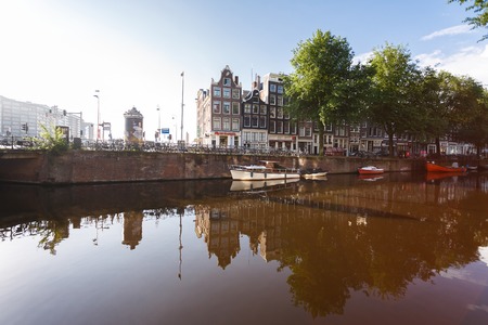 Amsterdam, Netherlands - July 03 2016: The traditional Dutch buildings, view from Geldersekade street at sunny morningのeditorial素材