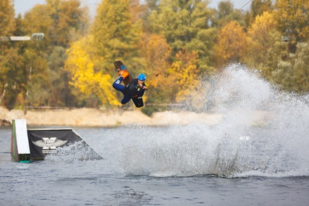 Kiyv, Ukraine - October 02 2016: The training of kite surfers on the lake in autumn city