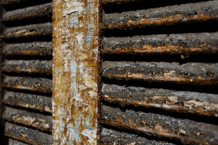 Shabby old paint on the surface of the old shuttersの写真素材