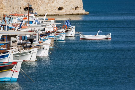 Fishing boats moored in the port of Heraklion, Greeceの写真素材