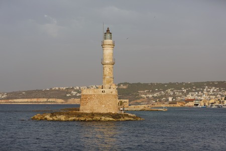 Chania, Greece - October 11 2016: People are resting near the lighthouse in the city of Chania in the eveningのeditorial素材
