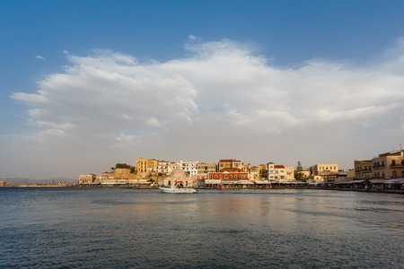 Chania, Greece - October 11 2016: huge swirling clouds over the bay in old town, evening timeのeditorial素材