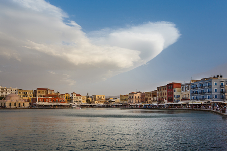 Chania, Greece - October 11 2016: huge swirling clouds over the bay in old town, evening timeのeditorial素材