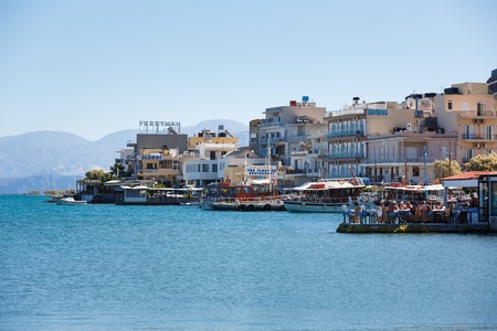 Elounda, Greece - October 14 2016: People are resting on a promenade of spa town of Elounda, autumn timeのeditorial素材