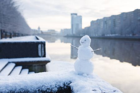The snowman on a riverbank in Kaliningrad, Russiaの写真素材