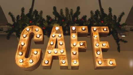The large decorated by lamps letters CAFEの写真素材