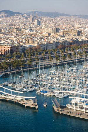 Barcelona, Spain - January 07 2017: Yachts in the bay in the background of cityscape of Barcelona, view from aboveのeditorial素材