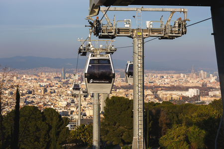 Barcelona, Spain - January 07 2017: The Montjuic Cable Car in the background of cityscape of Barcelonaのeditorial素材