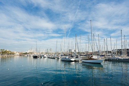 Barcelona, Spain - January 08 2017: Yachts in the bay in the background of blue skyのeditorial素材