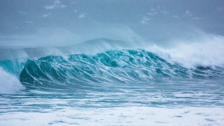 The great tide on the cold north sea during the snowstormの写真素材