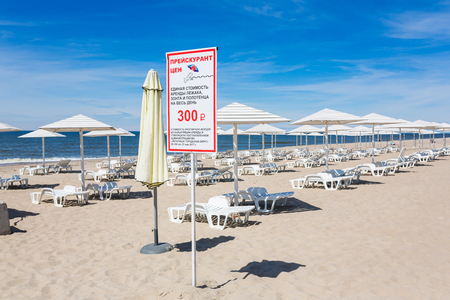 Yantarny, Russia - June 03 2017: Board with price-list on the beach in Yantarny resort town in summerのeditorial素材