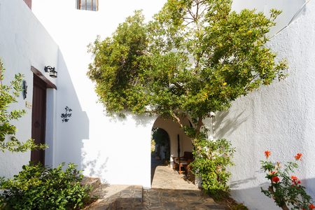 Amoudara, Greece - October 10 2016: The facade in a courtyard of the Cretan Village Hotel on the coast of the Crete Islandのeditorial素材