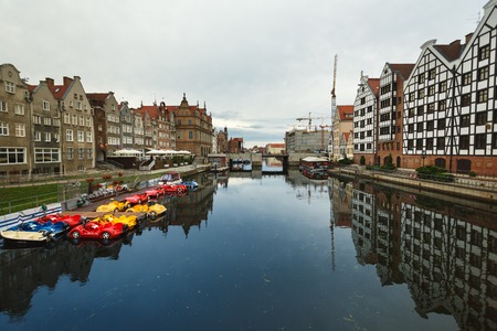 Gdansk, Poland - July 23 2017: Buildings of the old town Gdansk reflected in a water in early...