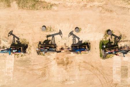 Aerial view of the row of oil derricks in summerの写真素材