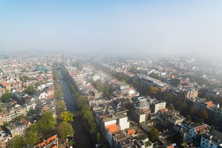 Aerial view of the foggy Amsterdam in autumnの写真素材