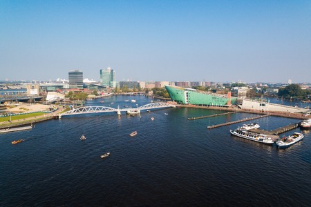 Tourist ships in canal of Amsterdam, aerial viewのeditorial素材