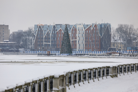 Kaliningrad, Russia - January 19 2018: The Christmas-tree on Upper Lake against the background of Mercure Hotel in deep winterのeditorial素材