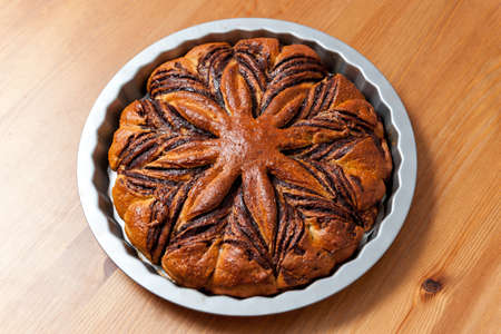 baked chestnut cake on a wood table