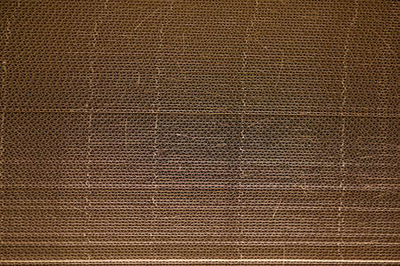 Corrugated cardboard for packing. abstract background horizontal lines with wavy lines of beige colorの写真素材