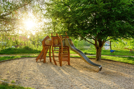Childrens wooden playground recreation area at public park.の写真素材