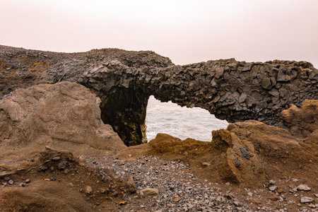 Arnardrangur sea stack at Reynisfjara beach in Iceland