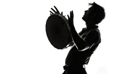 Silhouette of young man playing drum in studio on white background