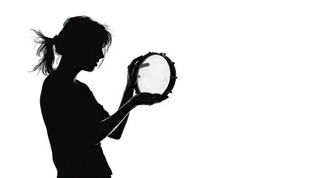 Silhouette of a girl with a tambourine on a white backgroundのイラスト素材