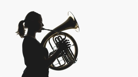 Silhouette of a woman playing the french horn on white background