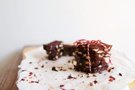 Peppermint, nut, chocolate bark tied together with red and white bakers twine.の写真素材