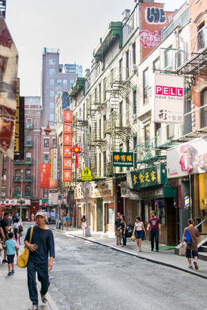 Urban scene in New York Citys Chinatown area, Manhattan, NYC medium shot