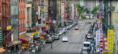 Looking down East Broadway in New York Citys Chinatown area of Downtown Manhattanのeditorial素材