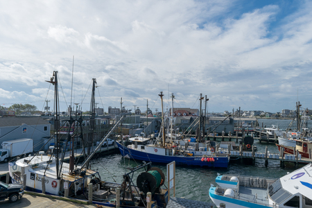 Blue fishing boat docked at the wharf at Point Judith, Rhodes Islandのeditorial素材