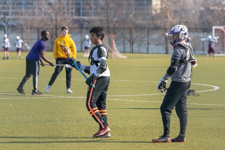 New York City, NY/USA - 3/19/2019: Lacrosse team during practice, Randalls Island, NYC