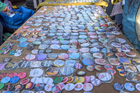 New York City, NY/USA - 11/09/2019: Stickers and buttons at an anti-Trump/Pence protest in downtown NYCのeditorial素材