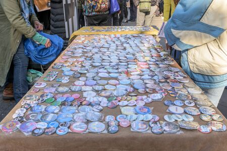 New York City, NY/USA - 11/09/2019: Stickers and buttons at an anti-Trump/Pence protest in downtown NYCのeditorial素材