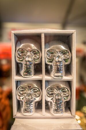Shiny silver metal skulls being sold at a local market in Upstate New Yorkの写真素材