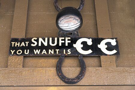 Lancaster, PA/USA - 12/29/2019: Vintage advertisment plaque mounted on a brown wooden wallのeditorial素材