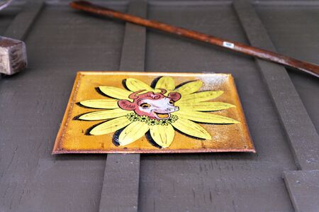 Lancaster, PA/USA - 12/29/2019: Vintage advertisment plaque mounted on a brown wooden wallのeditorial素材