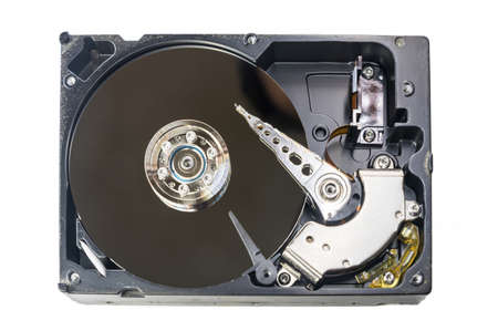 Old-fashioned, open, mechanical harddisc drive, isolated on a white background