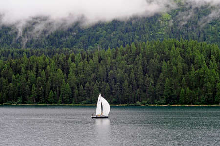 Sailing boat in Santkt Moritz's lakeの写真素材